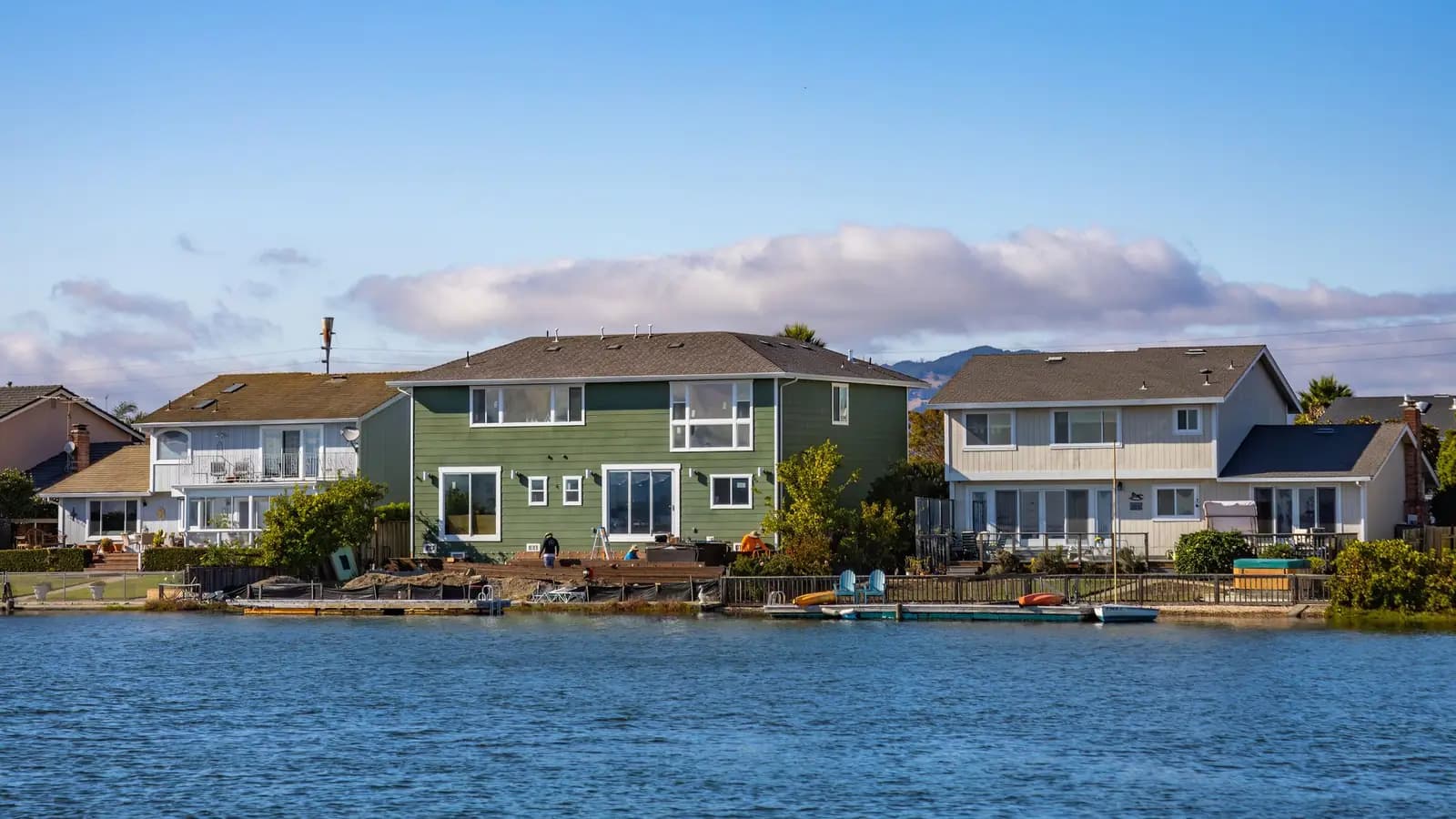 Waterfront homes with private docks lining a lakeshore community