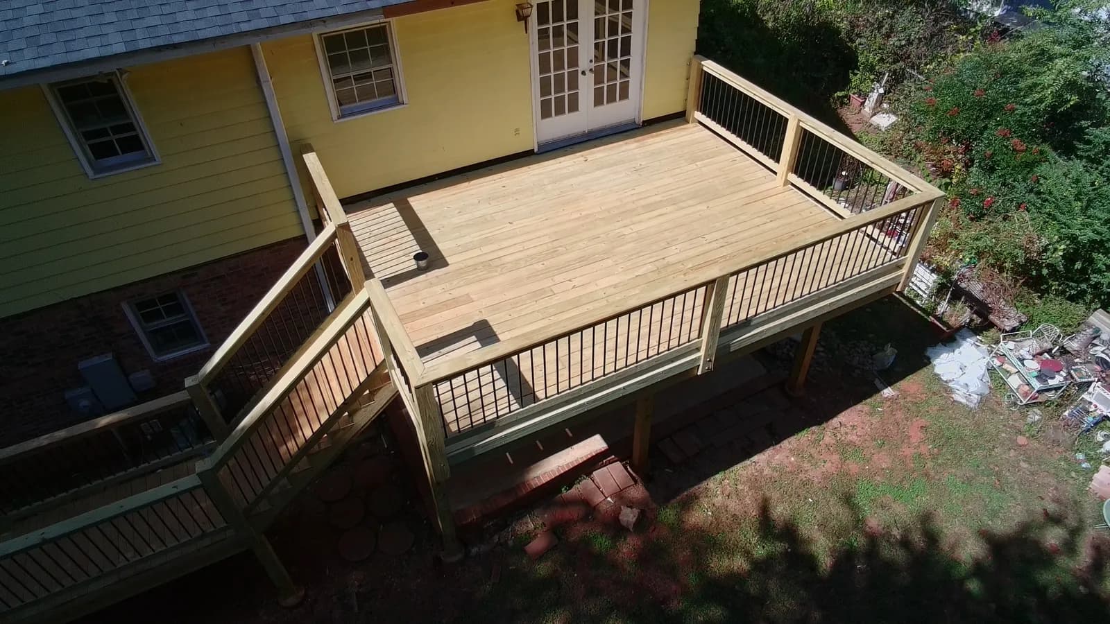 Multi-level wood deck with railings on an Upstate home