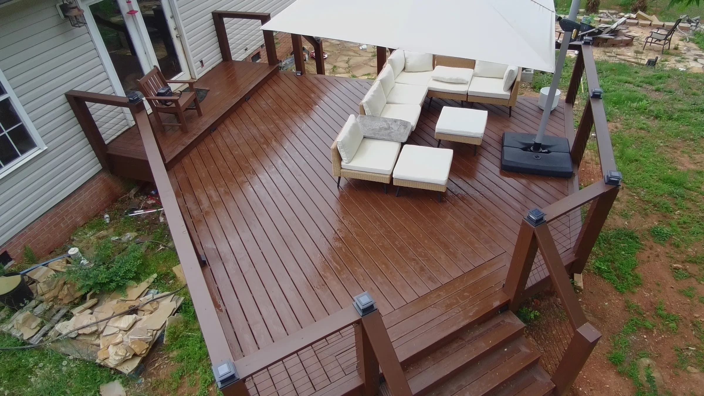 Multi-tier composite wraparound deck with lounge seating overlooking the Upstate — built by BHR Construction Co.